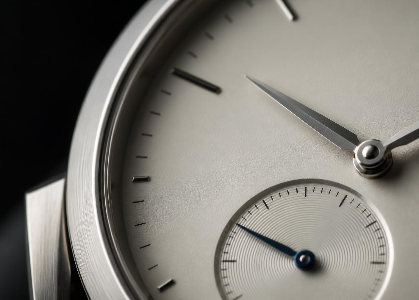 Detail of a fine mechanical watch dial in soft studio light